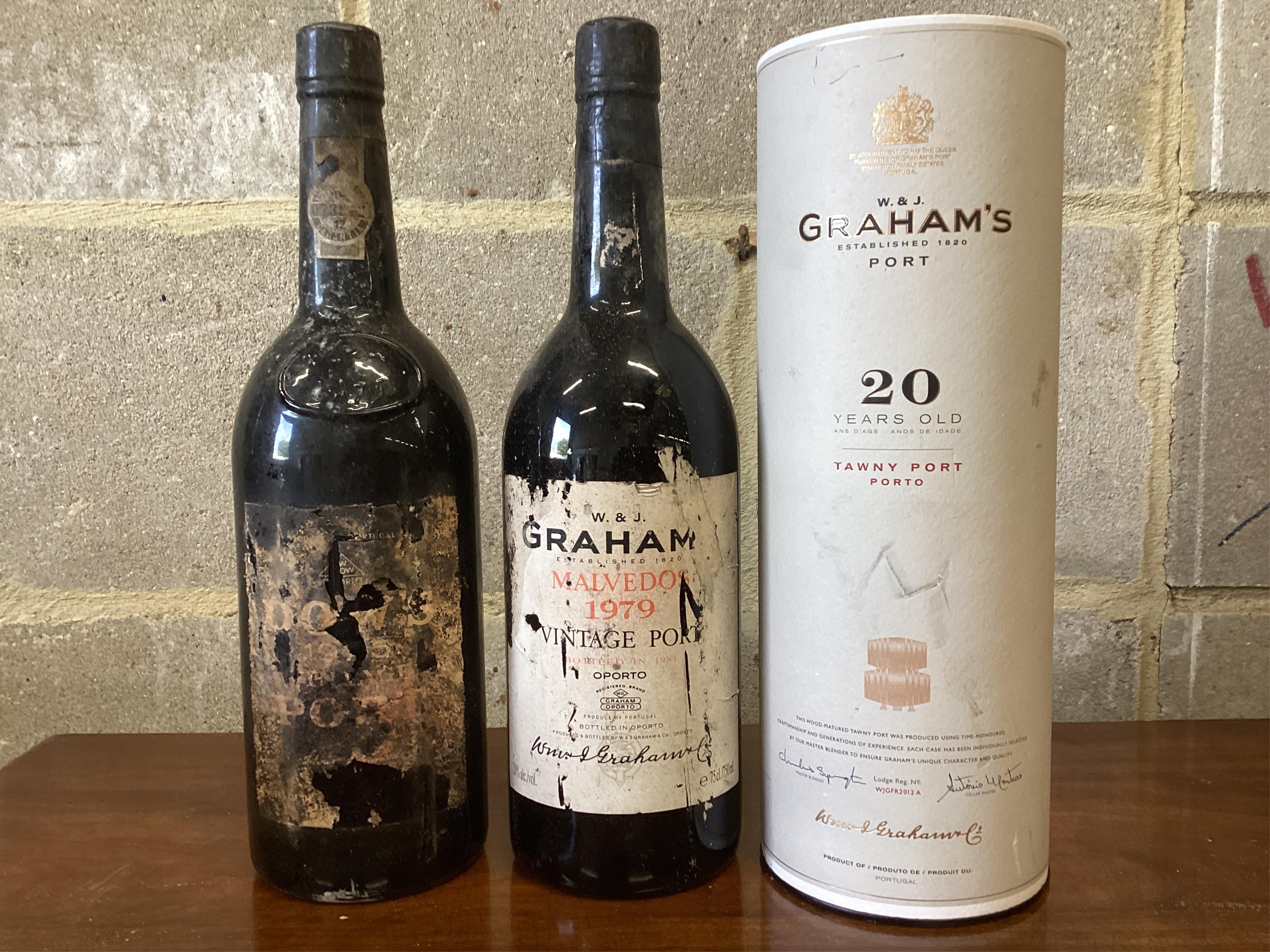 Two bottles of Graham’s vintage port and a bottle of Dows vintage port. (From a local private cellar). Condition - labels degraded